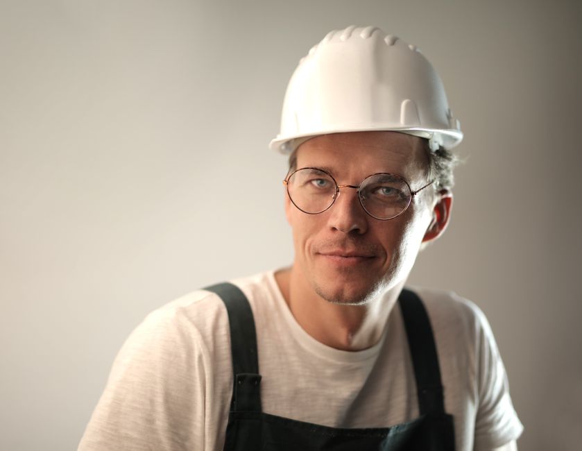 Smiling heating and cooling contractor ready to serve